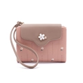 Close-up of pink PU leather wallet with floral accents and stitched litchi texture details - Dusty Pink