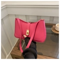 Detail of rose red underarm bag with gold twist lock and sleek curved PU leather finish - Rose Red