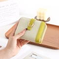 Detailed shot of avocado green and plaid PU leather wallet with golden U-shaped buckle - Green