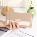 Detail of a khaki leather and off-white canvas long wallet with a gold nameplate - Apricot