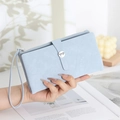 Detail of light blue PU leather long wallet with silver bow buckle and wavy stitching - Sky Blue