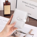 Detailed view of silver lychee texture wallet featuring a decorative leaf-shaped zipper - Silver