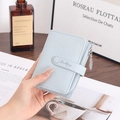 Close-up of light blue lychee pattern leather wallet with gold leaf zipper puller detail - Sky Blue