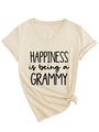 Detail eines beigen T-Shirts mit V-Ausschnitt, Grammy-Slogan und seitlichem Knoten - S / Druckknotenstil / Sandfarben