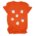 Détail d'un t-shirt de Noël orange avec des motifs de Père Noël en paillettes colorées - S / Hauts / Orange