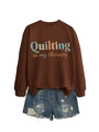 Flat lay of brown 'Quilting is my therapy' sweatshirt and distressed denim shorts - Coffee