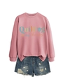 Detail of pink long sleeve sweatshirt with 'Quilting is my therapy' print and ripped denim shorts - Rose Gold