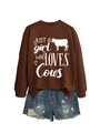 Flat lay of brown 'Just a girl who loves cows' sweatshirt with ripped denim shorts - Coffee (White Font)