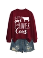 Flat lay of maroon sweatshirt with 'JUST A girl WHO LOVES Cows' print and denim shorts - Wine Red (White Font)
