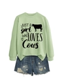 Detail of light green sweatshirt with cow graphic and distressed denim shorts - Olive Green (Black Font)