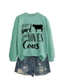 Detail of mint green sweatshirt with Just A Girl Who Loves Cows print and denim shorts - Light Green (Black Font)