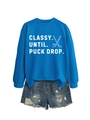 Flat lay of bright blue sweatshirt with Classy Until Puck Drop text and denim shorts - Lake Blue (White Print)