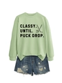 Flat lay of a light green crewneck sweatshirt and distressed denim shorts with hockey print - Olive Green (Black Print)