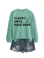 Detail view of mint green sweatshirt with hockey print and denim shorts on white background - Light Green (Black Print)