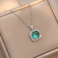 Macro shot of emerald green pendant necklace with zircon halo in premium jewelry box - Emerald Green Necklace (X2304)