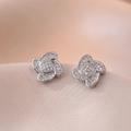 Sparkling four-petal clover stud earrings with pavé zircons on champagne satin background - Clover Earrings (E0615)