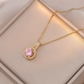 Pink zircon halo necklace with golden chain on champagne velvet jewelry box lid - Pink Zircon Necklace Set (X1158)