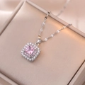 Macro detail of silver necklace with princess cut pink gem and double diamond halo - X1154 - Steel Color Powder Sugar Cube