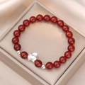 Red agate bead bracelet featuring a silver elephant charm on a premium silk display - Red Agate Rabbit Style (SF0006)