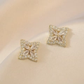 Sparkling gold four-pointed star stud earrings with zircon crystals and petal design - Gold Clover Earrings