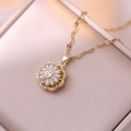 Macro shot of gold floral sunflower pendant with zircon stones in a jewelry box - Zirconia Rotatable Necklace (X2451)
