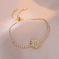 Elegant gold flower bracelet with sparkling zircon petals and adjustable bolo clasp chain - Rotating Zircon Bracelet (TS0192)