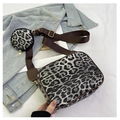 Detail view of leopard print bag set with round pouch on a brown wide strap - Black