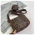 Close-up of leopard print makeup bag with detachable round coin purse and brown strap - Brown