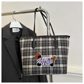 Detail of tartan tote bag with plush embroidered dachshund puppy and sturdy shoulder straps - Black