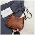 Detail of vintage brown leather handbag with Fashion embossing and adjustable strap - No Pendant / Brown