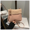 Close-up of pink matte crossbody bag with beige faux fur trim and gold buckle detail - Pink