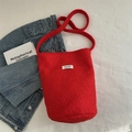 Winter plush wool bucket bag in vibrant red with stylish designer label and soft strap - Red