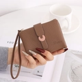 Brown lychee grain leather short wallet with pink C-buckle and matching hand strap - Brown