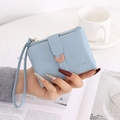 Detail of light blue lychee pattern wallet with golden crescent buckle and wristlet strap - Sky Blue