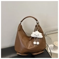 Detail of brown PU leather hobo bag with logo embossing and white plush cloud charm - With Pendant / Brown