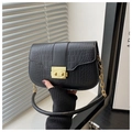 Macro shot of black crocodile embossed leather texture with elegant gold rectangle clasp - Black