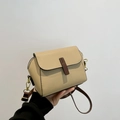 Beige litchi grain faux leather crossbody bag with brown straps and golden hooks - Khaki