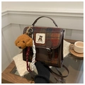 Detail of British style plaid handbag with leather trim and cute poodle charm - Coffee (With Pendant)