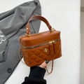 Brown quilted PU leather bucket bag with gold flower accent and chain strap handle - Brown