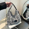 Retro black and white checkered knit hobo bag with a black leather shoulder strap - Black