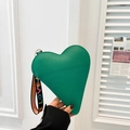 Green heart-shaped faux leather handbag with colorful LOVE print on a black wrist strap - Green