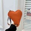 Orange heart-shaped leather wristlet bag with rainbow LOVE webbing strap and gold zipper - Orange