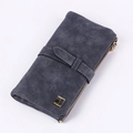 Detail of matte dark blue wallet with white stitching and FRIEND gold logo plate - Black
