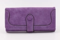 Close-up of purple faux suede wallet with decorative white stitching and snap button - Long Style / Purple