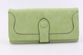 Detail of light green suede wallet with contrast stitching and round button closure - Long Style / Grass Green