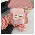 Detail of pink canvas crossbody bag with Fashion patch and adjustable shoulder strap - Letter Patch Style (FASHION Pink)
