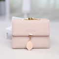 Women's short tri-fold faux leather wallet in light pink with golden leaf pendant - Pink