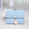 Short light blue PU leather wallet for women with golden leaf pendant and button closure - Sky Blue