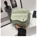Light green nylon crossbody bag with cute sausage dog print and puppy charm - Green