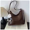 Detail of dark brown hobo tote bag with a white plush cloud charm and retro aesthetic - Coffee with Pendant